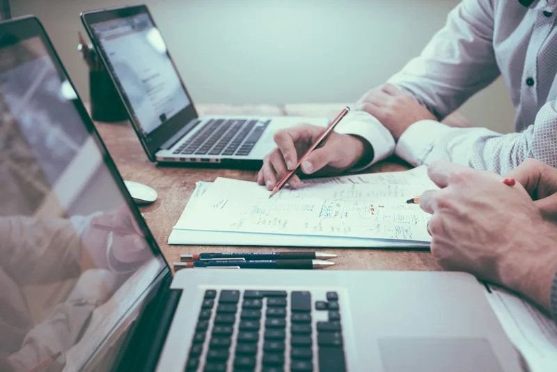 Business professional analyzing market data and contracts
